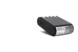 small flash-manual camera on a white background is an accessory for beginner photographers looking for sharpness. photo