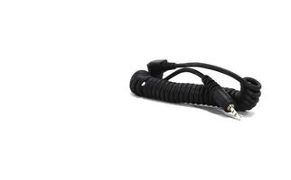 Cable for synchronizing the camera and flash on a white background. photo