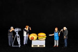 Miniature people Chefs is preparing a bakery in The studio photo