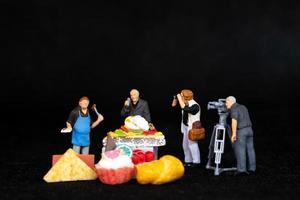 Miniature people Chefs is preparing a bakery in The studio photo