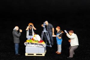 Miniature people Chefs is preparing a bakery in The studio photo