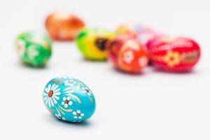 Handmade Easter eggs on white. Spring patterns art, unique. photo