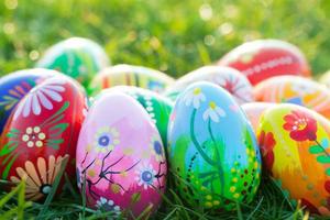 Hand painted Easter eggs on grass. Spring patterns art, unique. photo