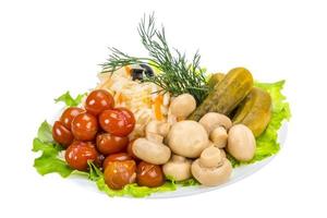 Marinated vegetables on white photo