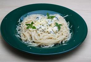 Pasta with blue cheese and basil photo