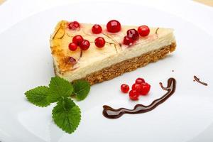 Cheesecake with berries and mint photo