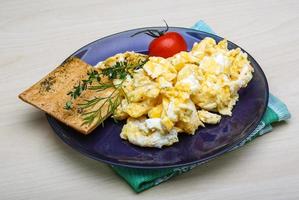 Scrambled eggs with tomato photo