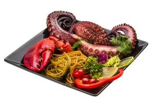 Seafood pasta with octopus and lobster leg photo