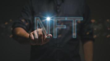 NFT non fungible tokens concept. Businessman touch digital unique art NFT hologram on digital binary background. photo