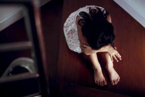 Sad child from this father and mother arguing, family negative concept.vintage color photo