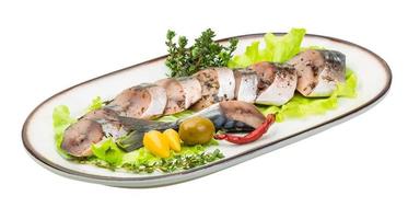 Mackerel fish, sliced on a plate with lettuce photo