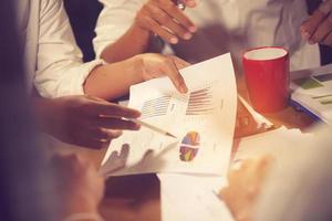 Financial advisor, accounting and Investment concept, business owners consult adviser financial meeting to analyze and on the finance report in the his office room.vintage color photo