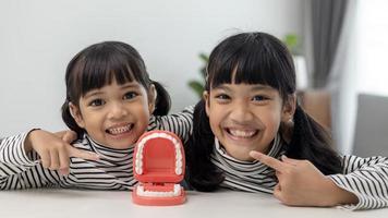 little girl smiling with a happy and cool smile on face. showing teeth. photo