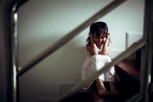 Sad child from this father and mother arguing, family negative concept.vintage color photo