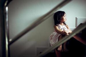 Sad child from this father and mother arguing, family negative concept.vintage color photo