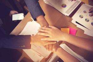 success and winning concept - happy business team celebrating victory in office.vintage color photo