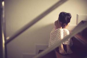 Sad child from this father and mother arguing, family negative concept.vintage color photo