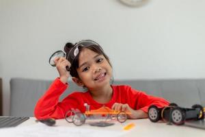 Asia students learn at home in coding robot cars and electronic board cables in STEM, STEAM, mathematics engineering science technology computer code in robotics for kids concept. photo