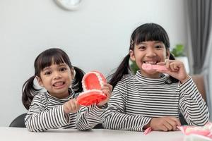 little girl smiling with a happy and cool smile on face. showing teeth. photo