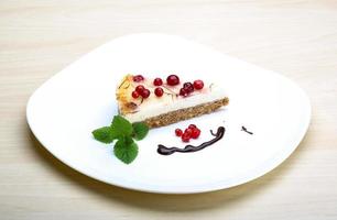 Cheesecake with berries and mint photo