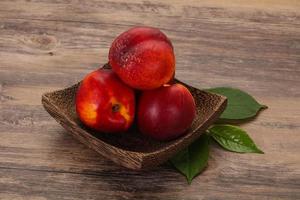 Sweet tasty ripe few nectarines photo