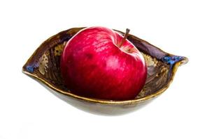 fresh red apples in the dish isolated on white background photo