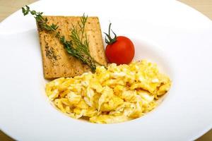 Scrambled eggs with tomato photo