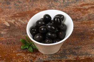 Black olives in the bowl photo