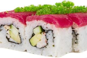Maki Sushi - Roll made of Crab, avocado, cucumber inside. Fresh Tuna and tobico roe outside photo