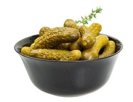 Marinated cucumbers, pickles in a bowl photo