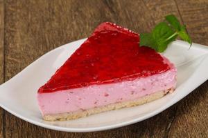 Soft Raspberry cheesecake served mint photo