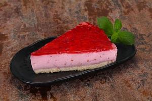 Soft Raspberry cheesecake served mint photo