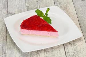 Soft Raspberry cheesecake served mint photo