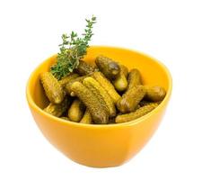 Marinated cucumbers, pickles in a bowl photo