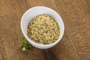 Peeled hemp seeds in the bowl photo
