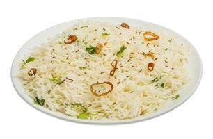Cumin rice on white photo