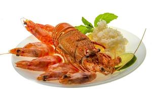 Spiny lobster, shrimps and rice photo