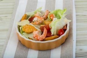 Caesar salad with shrimps photo