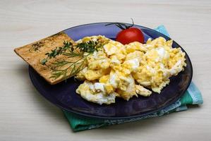 Scrambled eggs with tomato photo