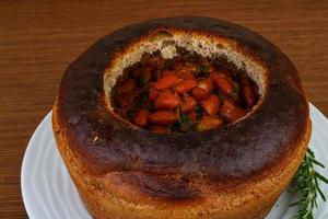 Bean soup in bread photo