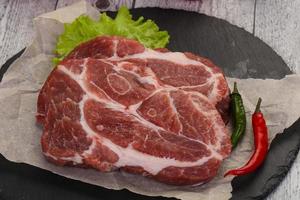 Raw pork neck steak photo