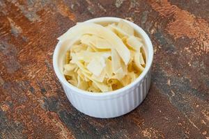 Coconut dry chips in the bowl photo