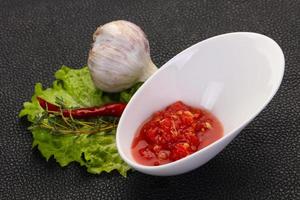 Spicy tomato and garlic sauce photo