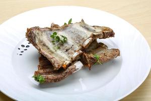 Roasted pork ribs photo