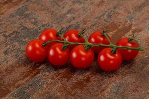 Ripe tomatoes on the branch photo