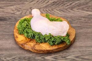 Raw chicken leg for cooking photo