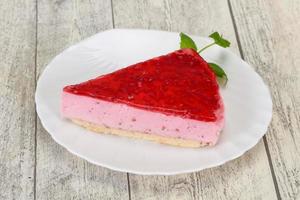 Soft Raspberry cheesecake served mint photo