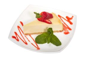 a piece of strawberry cheesecake on whit photo