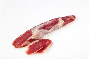 Smoked pork meat over white background photo