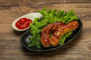 Roasted chicken white sausages with ketchup photo